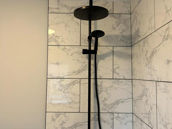 Empire trades black rainfall shower